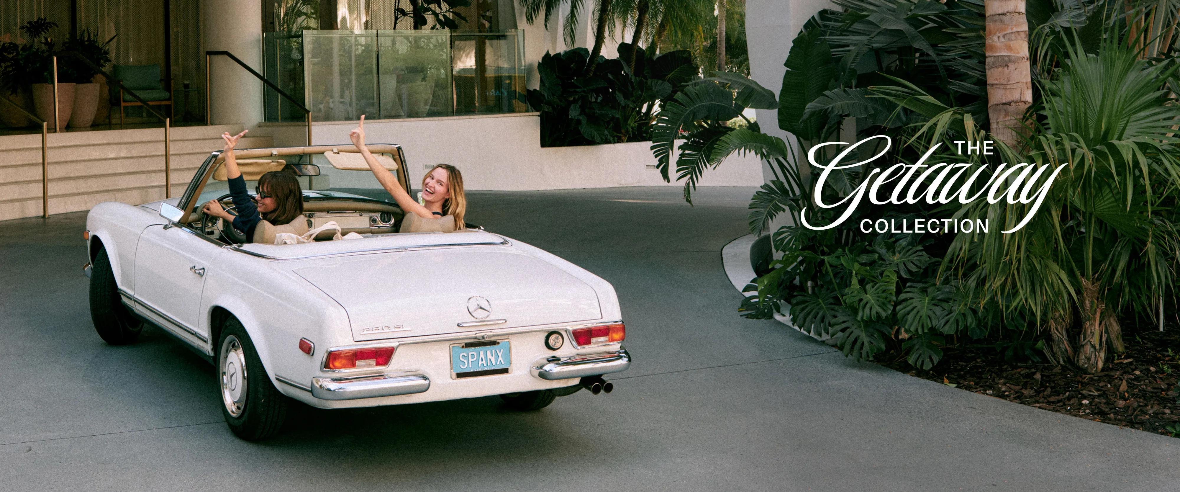 SPANX — two women celebrating in a vintage white convertible, one in a navy top, one in a tan top