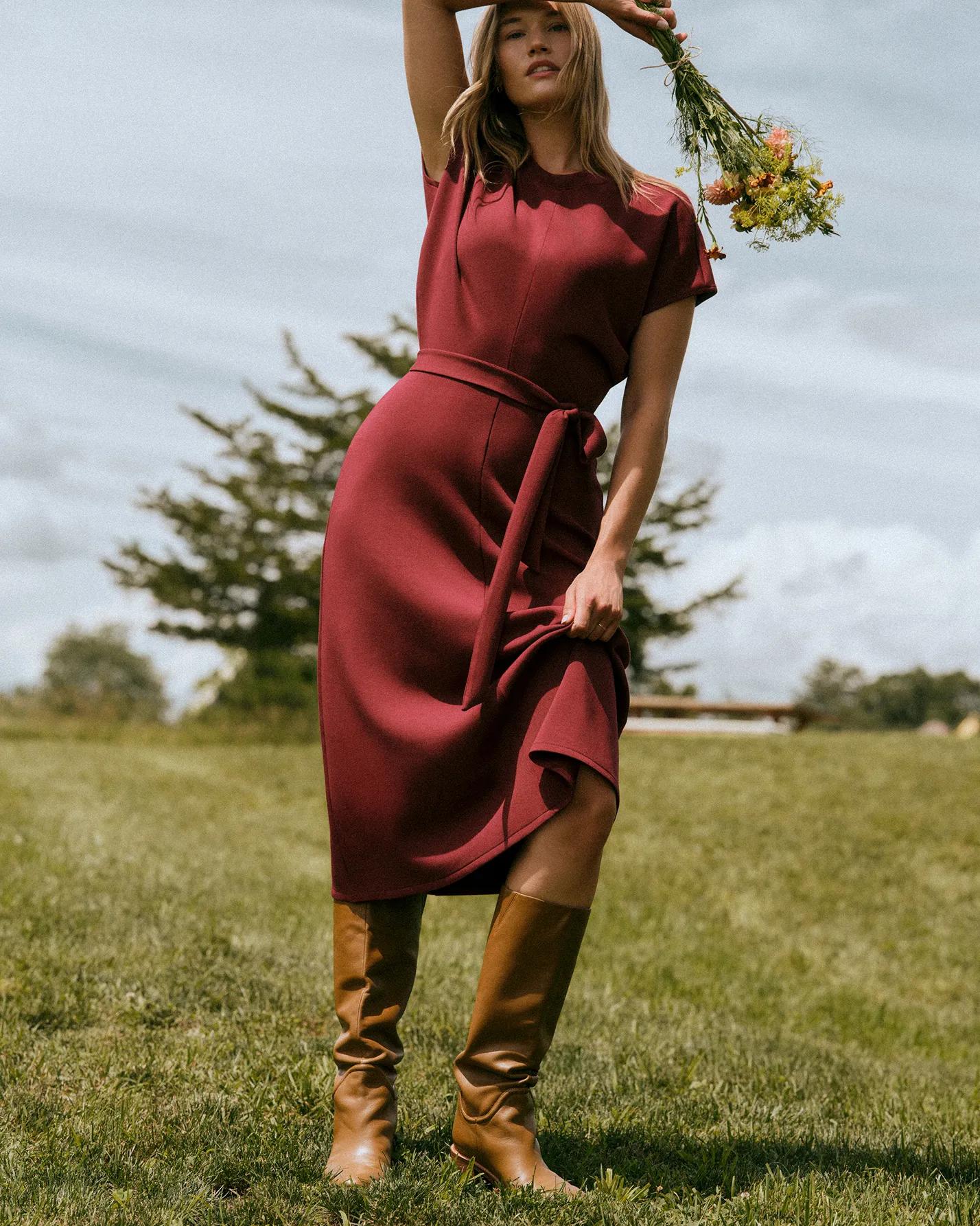 Woman in red Airessentials drapped dress