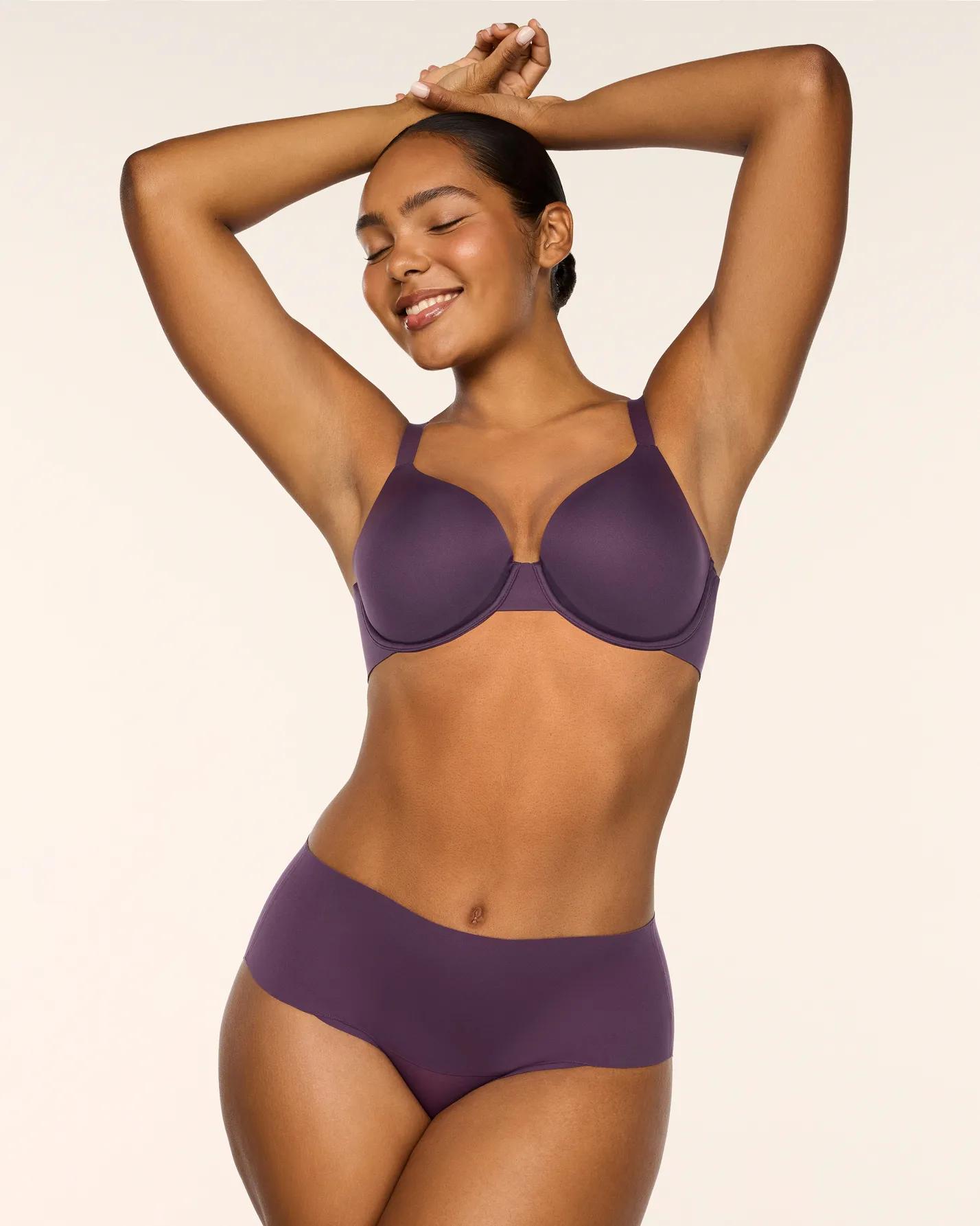 model in purple Spanx bra and panty set