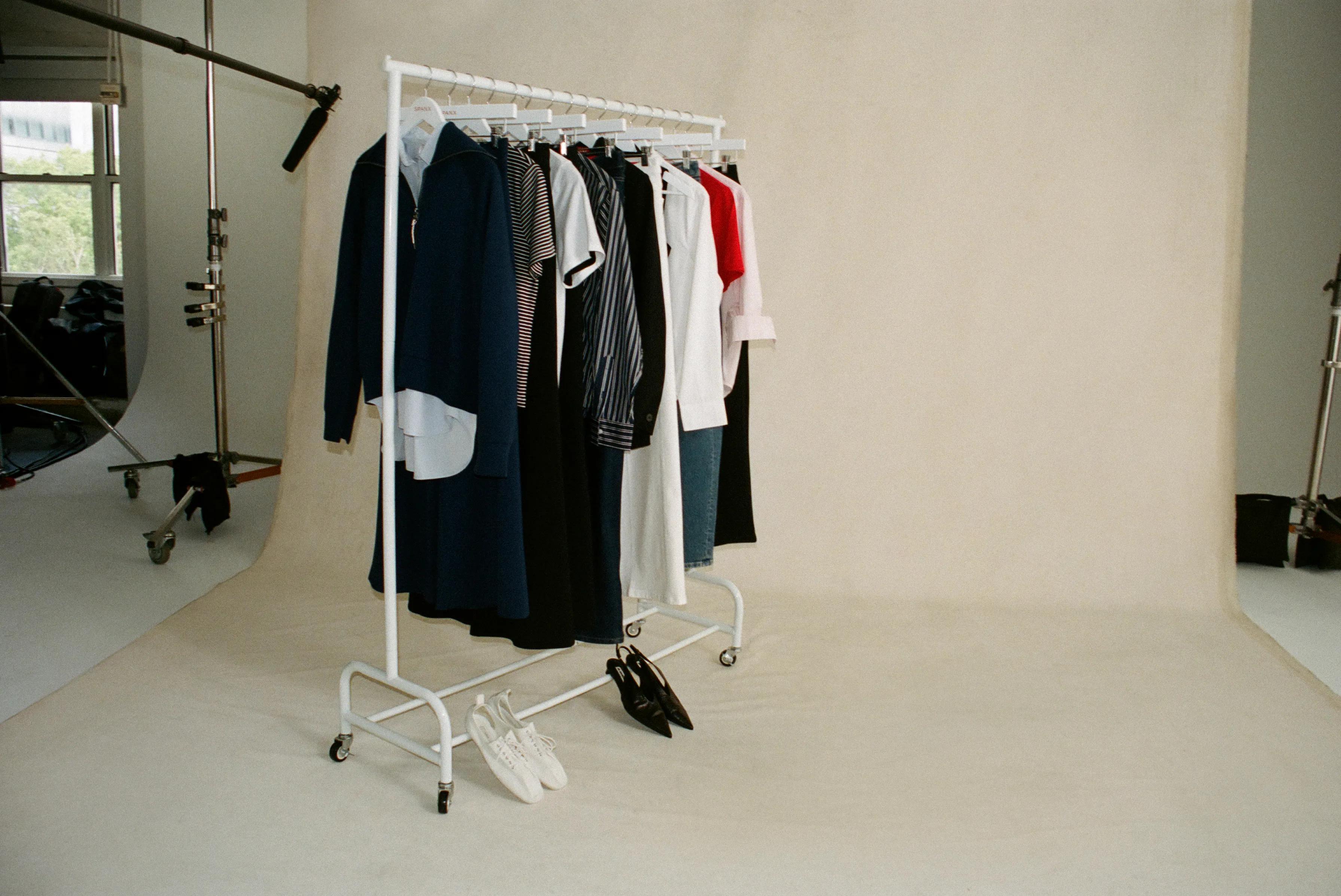 A clothes rack full of SPANX clothing