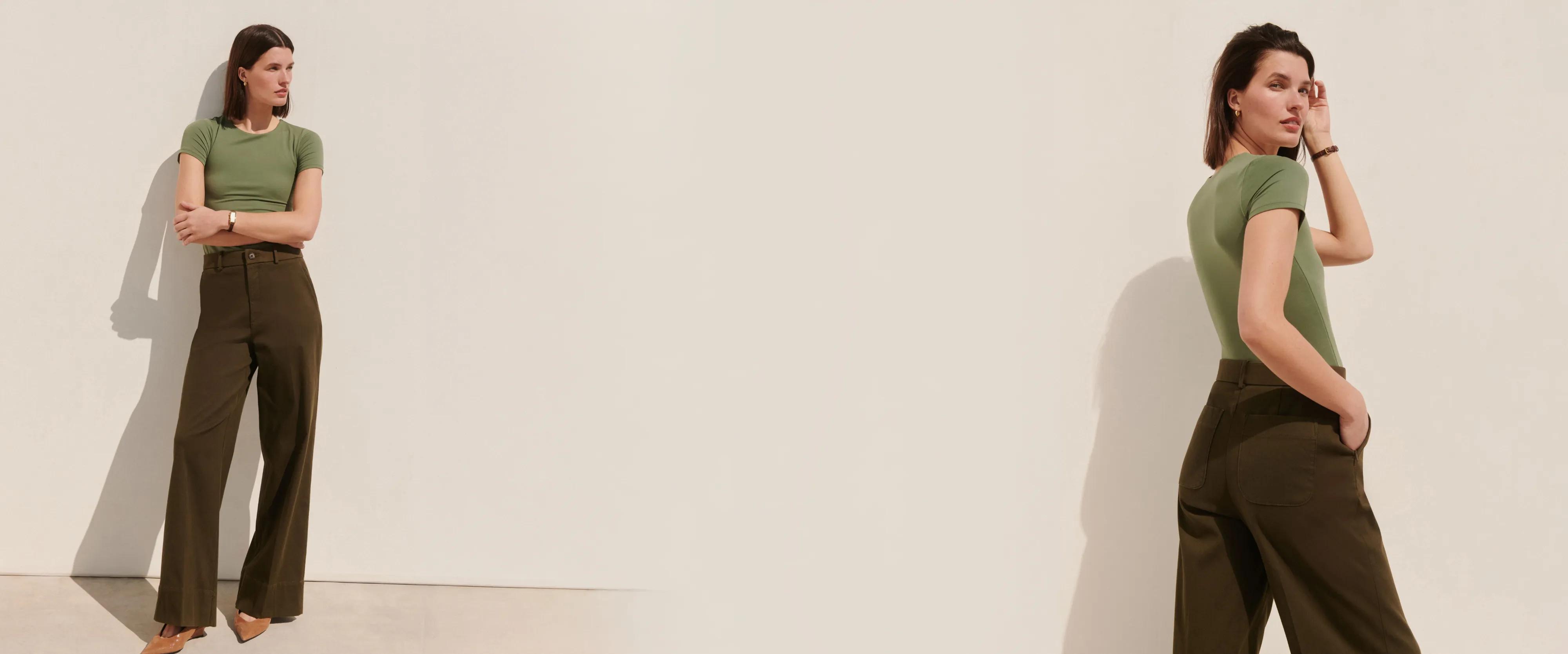 Model wearing olive wide-leg trousers with side stud detailing and a fitted sage green crewneck tee, shown front and bac