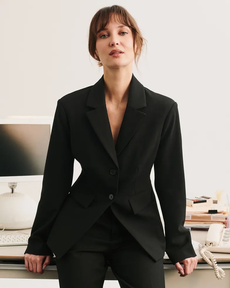 Woman in knit blazer work outfit