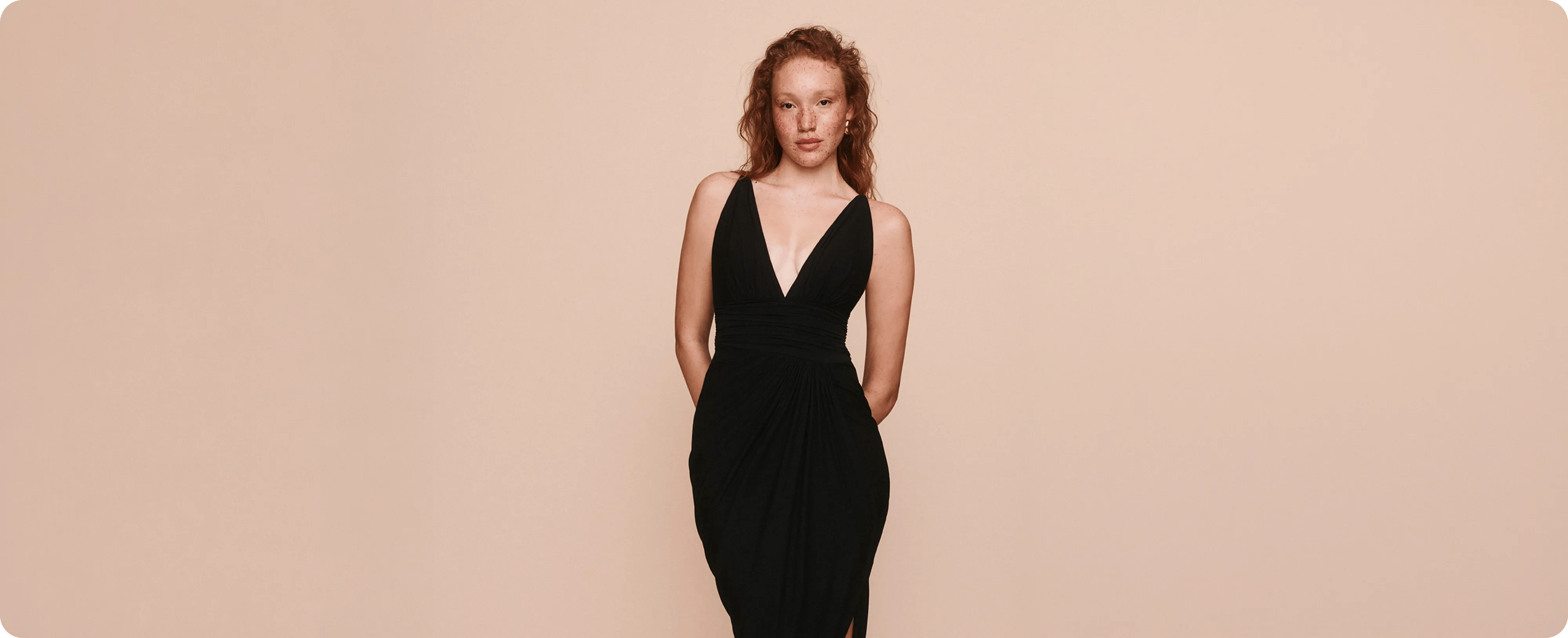 woman wearing plunging black dress