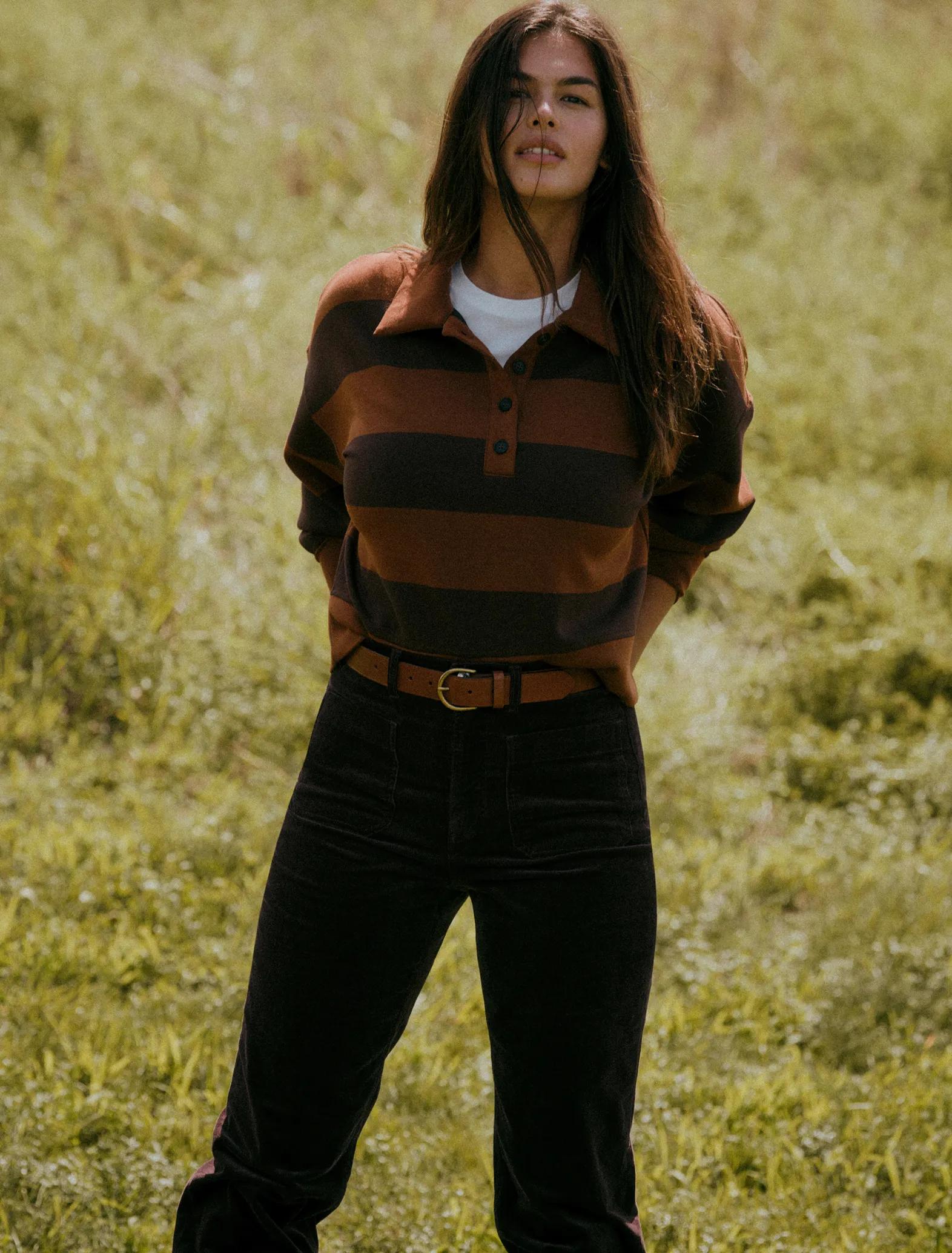 a model in a field in SPANX airessentials rugby top