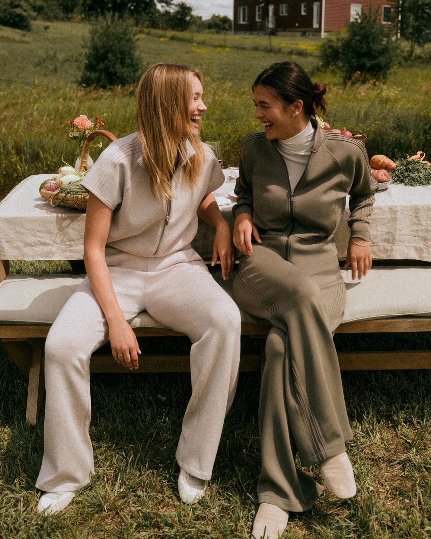 Two women in spanx airessentials pintuck matching sets